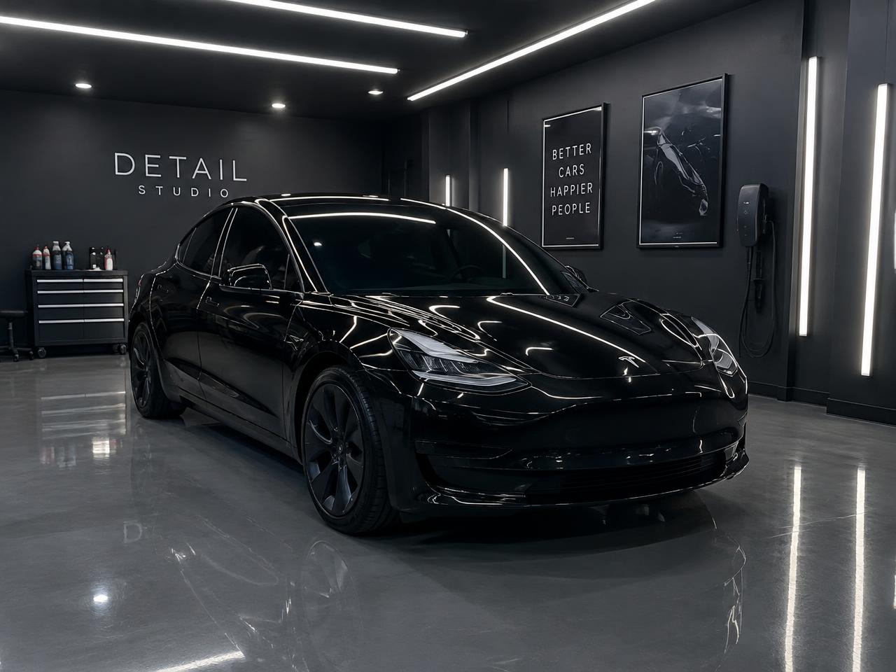 Black Tesla Model 3 with tinted windows